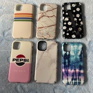 Assorted Decorative iPhone 11 Cases - Pink, White, Black, Blue Designs.